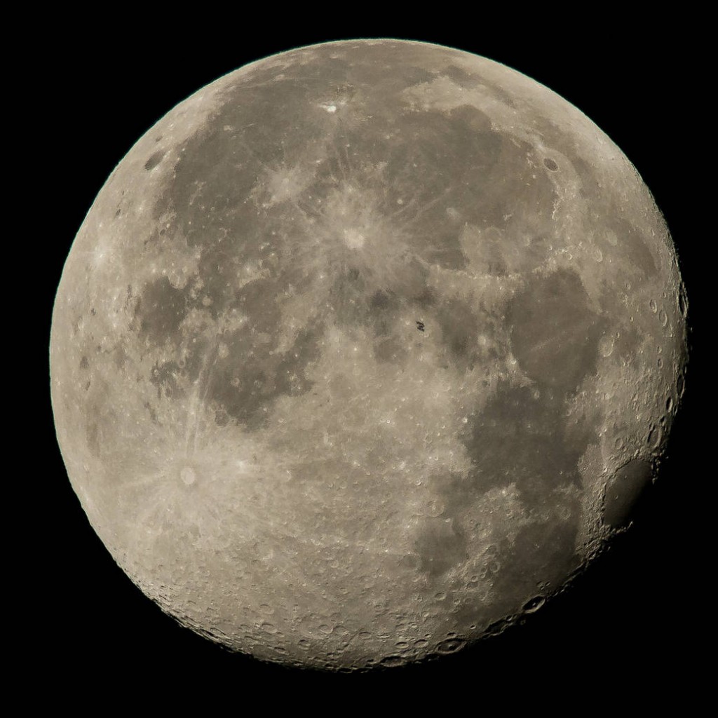 The International Space Station, with a crew of six onboard, is seen in silhouette as it transits the moon at roughly five miles per second, Sunday, Aug. 2, 2015, Woodford, VA. Onboard are; NASA astronauts Scott Kelly and Kjell Lindgren: Russian Cosmonauts Gennady Padalka, Mikhail Kornienko, Oleg Kononenko, and Japanese astronaut Kimiya Yui. Photo Credit: (NASA/Bill Ingalls)