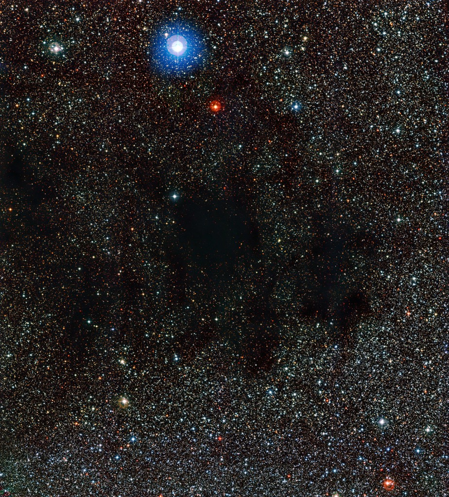 This image from the Wide Field Imager on the MPG/ESO 2.2-metre telescope shows part of the huge cloud of dust and gas known as the Coalsack Nebula. The dust in this nebula absorbs and scatters the light from background stars.