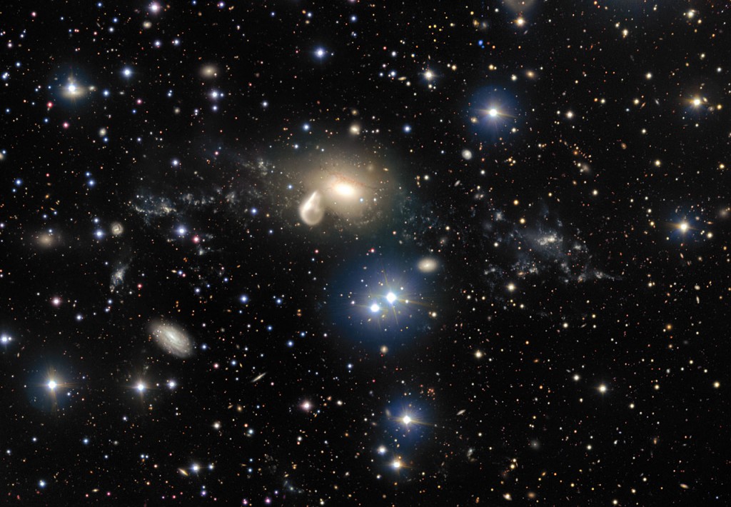 The spectacular aftermath of a 360 million year old cosmic collision is revealed in great detail in this image from ESO’s Very Large Telescope at the Paranal Observatory. Among the debris surrounding the elliptical galaxy NGC 5291 at the centre is a rare and mysterious young dwarf galaxy, which appears as a bright clump towards the right of the image. This object is providing astronomers with an excellent opportunity to learn more about similar galaxies that are expected to be common in the early Universe, but are normally too faint and distant to be observed by current telescopes.