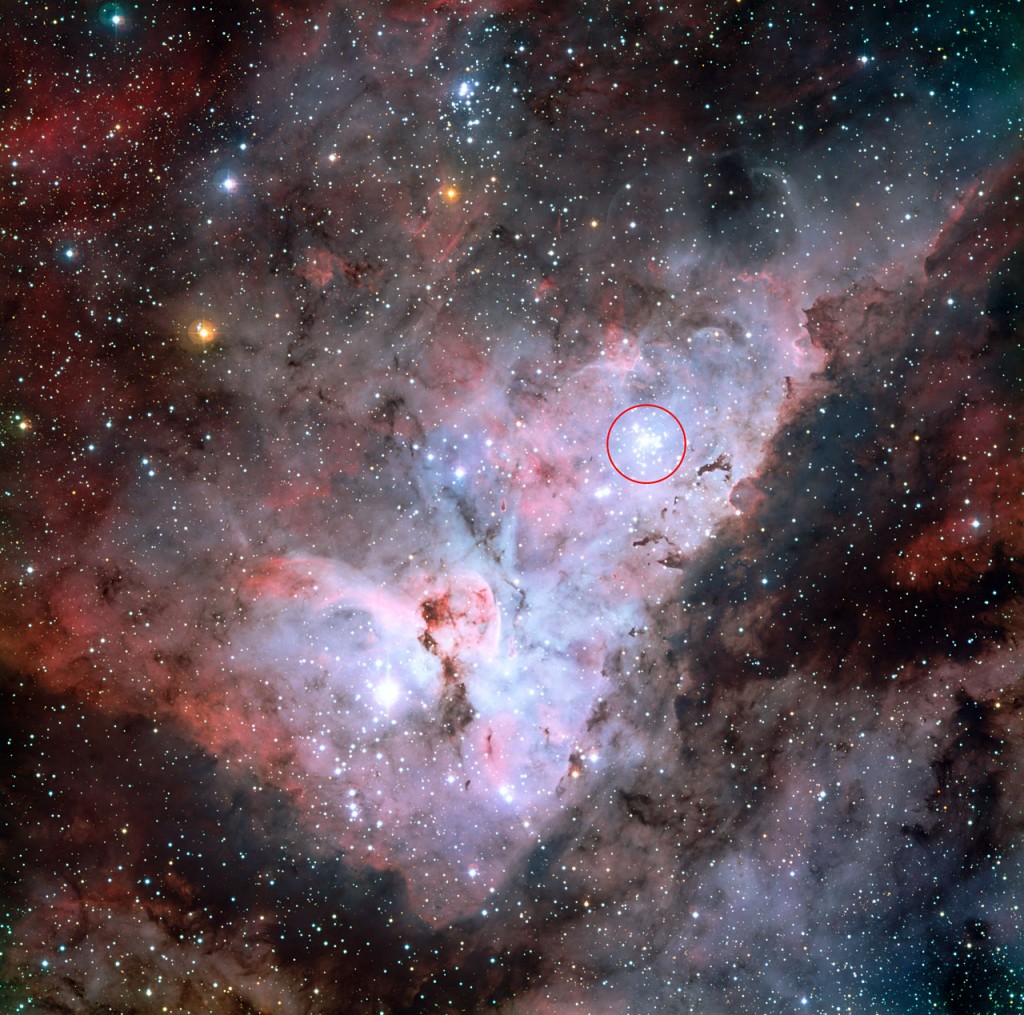This colour-composite image of the Carina Nebula, made by the MPG/ESO 2.2-metre telescope at La Silla, Chile, reveals exquisite details in the stars and dust of the region. The open star cluster Trumpler 14, a collection of very bright, young stars within the Carina Nebula, is marked with a red circle. Several more well known astronomical objects can be seen in this wide field image: to the bottom left of the image is one of the most impressive binary stars in the Universe, Eta Carinae, with the famous Keyhole Nebula just adjacent to the star. A second open star cluster, Collinder 228 is also seen in the image, just below Eta Carinae.