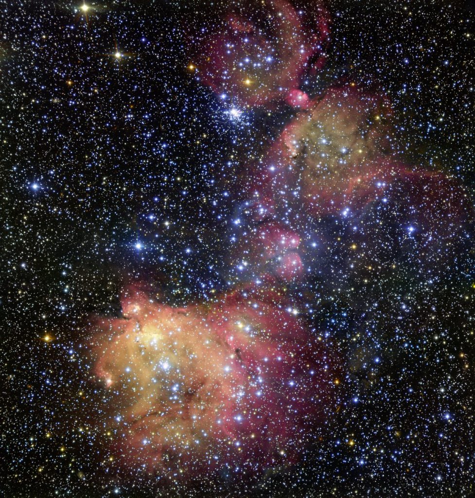 In this image from ESO’s Very Large Telescope (VLT), light from blazing blue stars energises the gas left over from the stars’ recent formation. The result is a strikingly colourful emission nebula, called LHA 120-N55, in which the stars are adorned with a mantle of glowing gas. Astronomers study these beautiful displays to learn about the conditions in places where new stars develop.