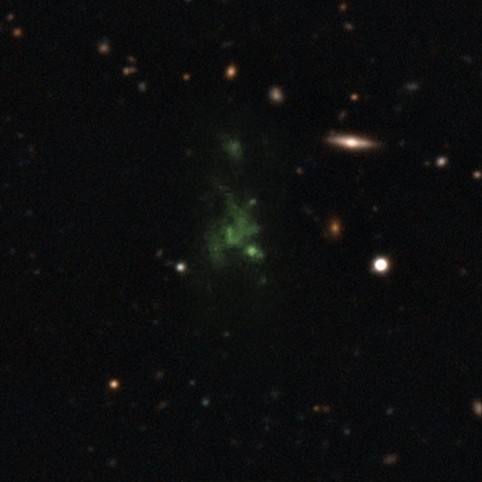 This image shows one of the largest known single objects in the Universe, the Lyman-alpha blob LAB-1. This picture is a composite of two different images taken with the FORS instrument on the Very Large Telescope (VLT) — a wider image showing the surrounding galaxies and a much deeper observation of the blob itself at the centre made to detect its polarisation. The intense Lyman-alpha ultraviolet radiation from the blob appears green after it has been stretched by the expansion of the Universe during its long journey to Earth. These new observations show for the first time that the light from this object is polarised. This means that the giant "blob" must be powered by galaxies embedded within the cloud.
