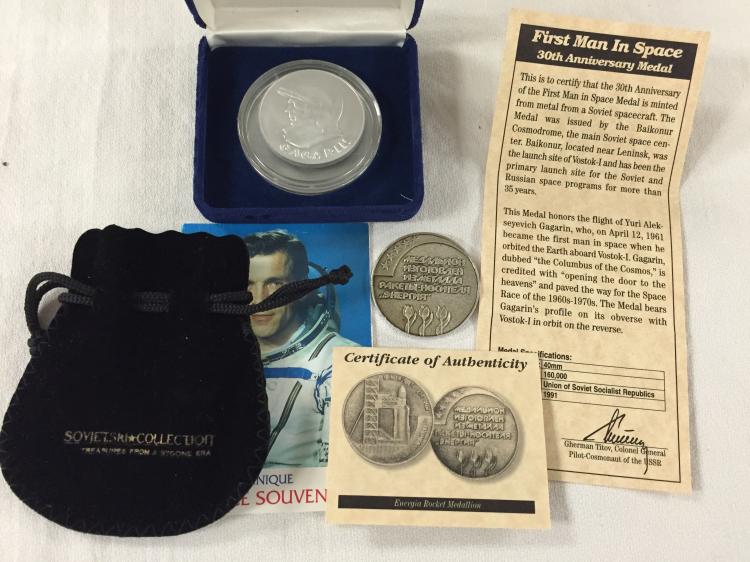 Three (3) "Flown" Russian Space Program souvenirs; a cosmonaut-endorsed flown Soyuz alloy card and two nice medallions