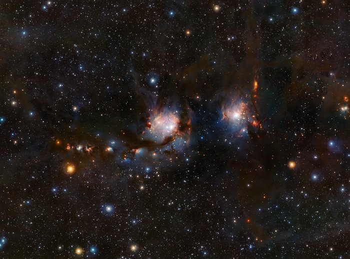 This richly detailed view of the star formation region Messier 78, in the constellation of Orion (The Hunter), was taken with the VISTA infrared survey telescope at ESO’s Paranal Observatory in Chile. As well as the blue regions of reflected light from the hot young stars the image also shows streams of dark dust and the red jets emerging from stars in the process of formation.