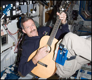 NASA astronaut Dan Burbank plays guitar on ISS