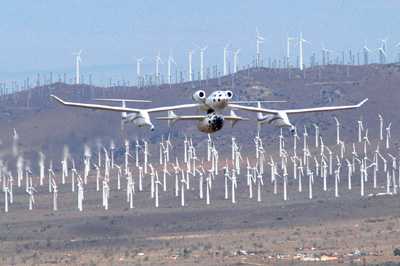 White Knight with StarShipOne over a field of windmills