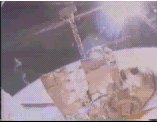 Cosmonaut holding satellite